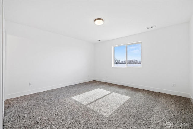 carpeted empty room with baseboards and visible vents