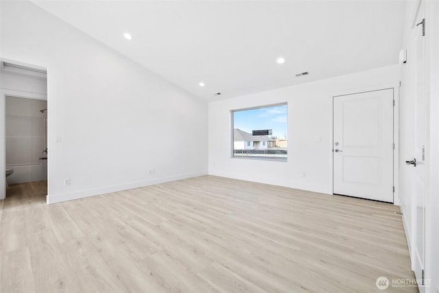 unfurnished living room featuring recessed lighting, baseboards, visible vents, and light wood finished floors