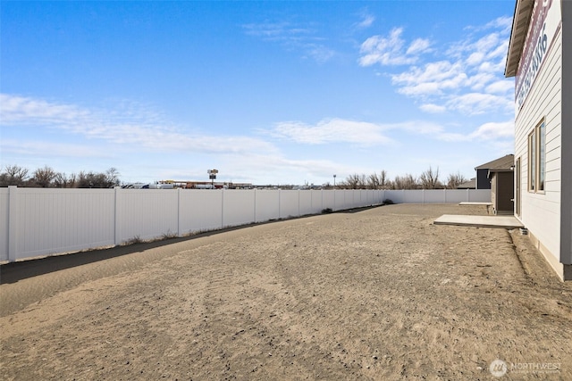 view of yard featuring a fenced backyard and a patio