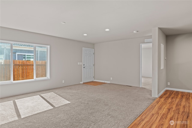 unfurnished room featuring wood-type flooring