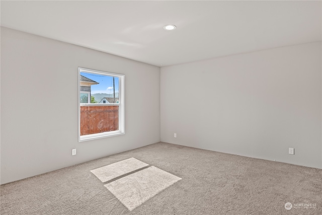 empty room with carpet flooring