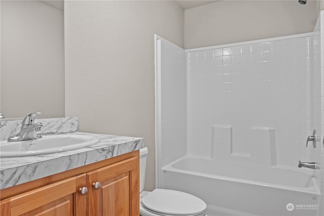 full bathroom with washtub / shower combination, toilet, and vanity