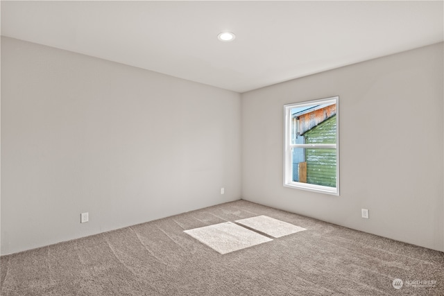 unfurnished room featuring carpet