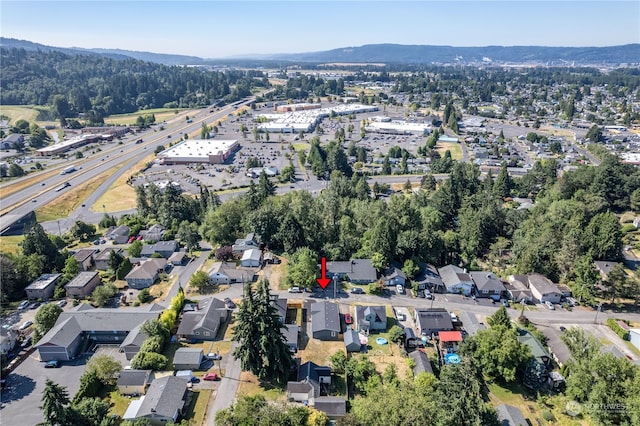 drone / aerial view featuring a mountain view