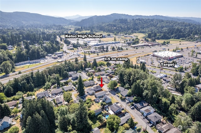 birds eye view of property with a mountain view