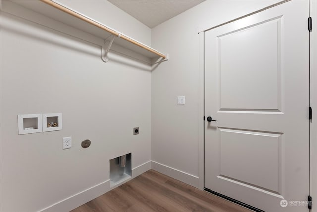 laundry area with hookup for an electric dryer, light wood-type flooring, and washer hookup