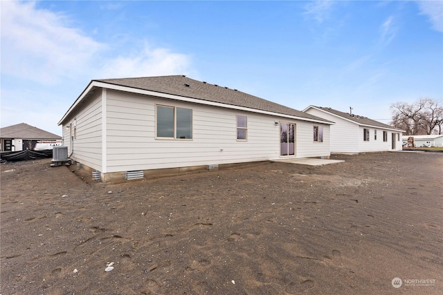 rear view of property with a patio area and central AC unit