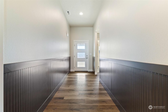 hallway featuring dark hardwood / wood-style flooring