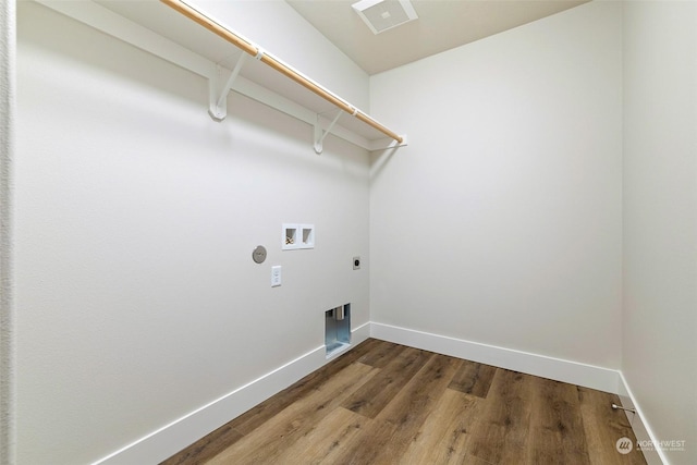 laundry room featuring washer hookup, hardwood / wood-style flooring, and electric dryer hookup