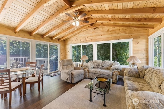 sunroom featuring vaulted ceiling with beams, ceiling fan, plenty of natural light, and wood ceiling