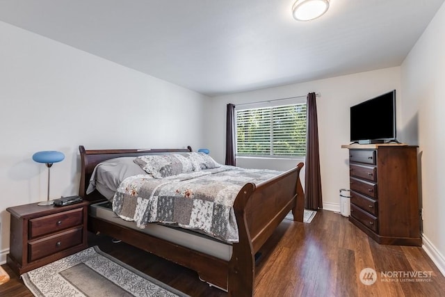 bedroom featuring dark hardwood / wood-style flooring