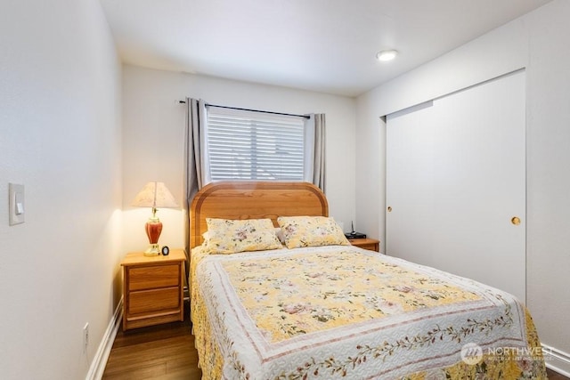 bedroom with hardwood / wood-style flooring