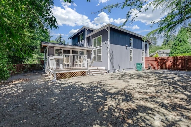 rear view of property with a deck