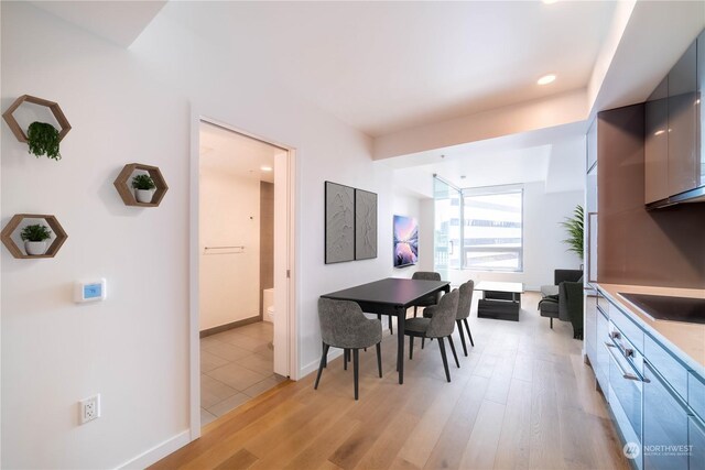 kitchen featuring light hardwood / wood-style floors and black electric stovetop