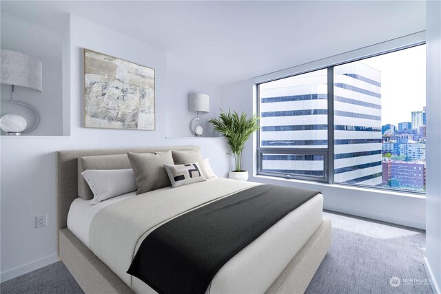 bedroom featuring multiple windows and carpet flooring