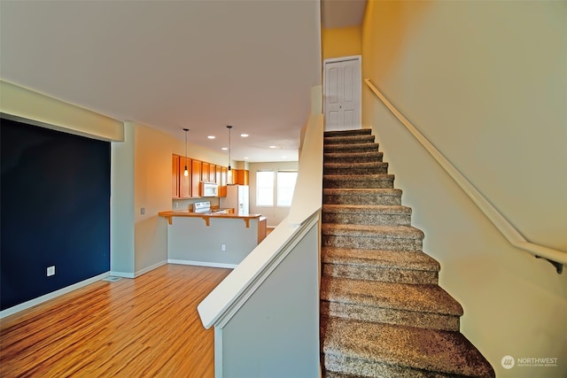 stairway featuring hardwood / wood-style flooring