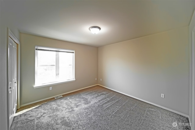 empty room with carpet floors