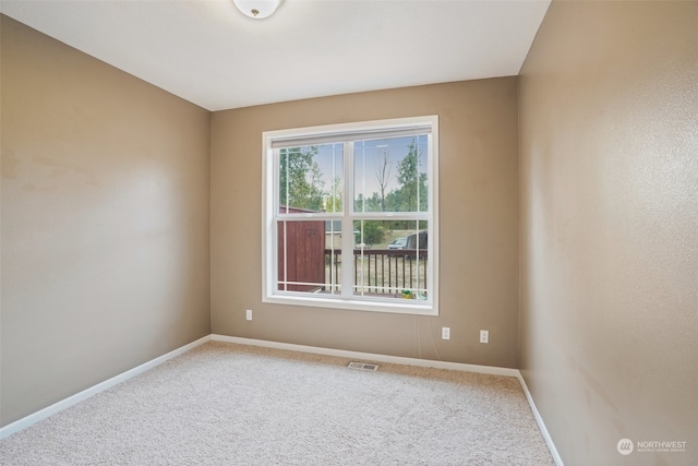 spare room with carpet flooring