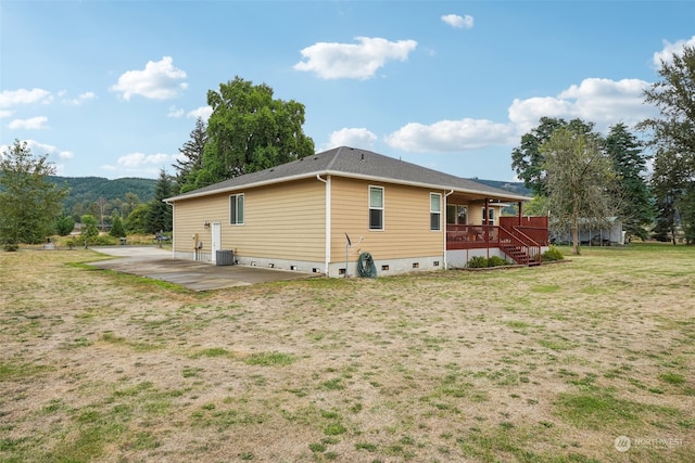 view of home's exterior with a yard and a patio