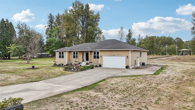 ranch-style home featuring a front yard and a garage