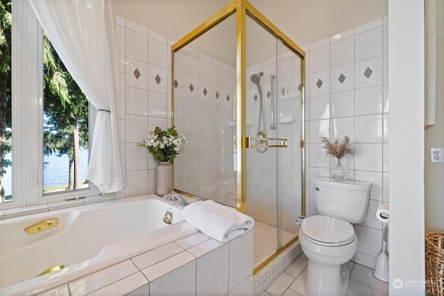 bathroom featuring a garden tub, tile walls, toilet, a shower stall, and tile patterned flooring