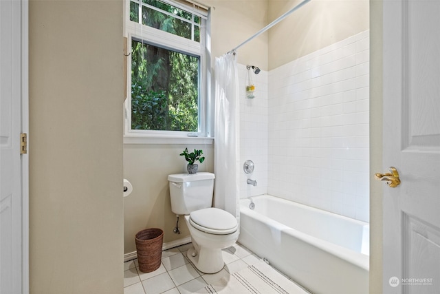 bathroom with tile patterned flooring, toilet, and shower / bath combination with curtain