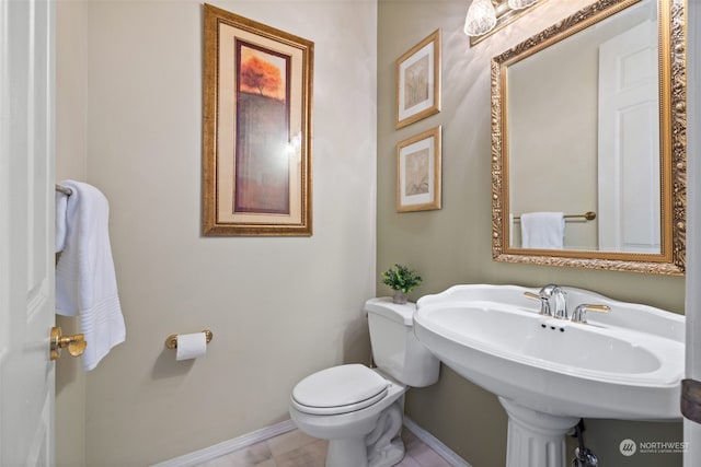 bathroom featuring tile patterned floors and toilet