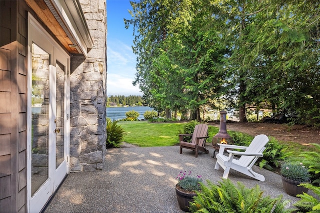 view of patio with a water view