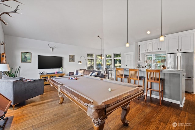 rec room featuring high vaulted ceiling and wood finished floors