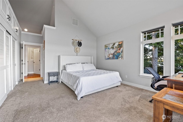 bedroom featuring high vaulted ceiling, baseboards, visible vents, and light colored carpet