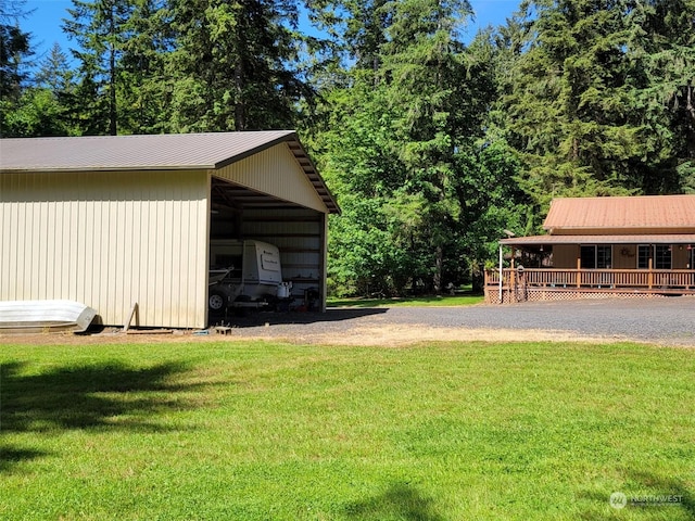 view of yard with an outbuilding and a wooden deck