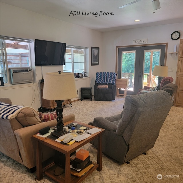 carpeted living room with plenty of natural light, cooling unit, ceiling fan, and french doors