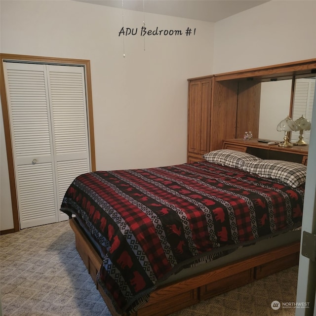 bedroom featuring carpet and a closet