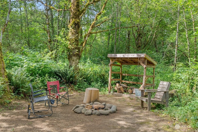 view of patio / terrace with an outdoor fire pit