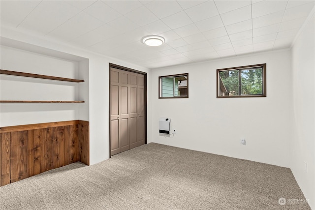 unfurnished bedroom featuring carpet floors and ornamental molding