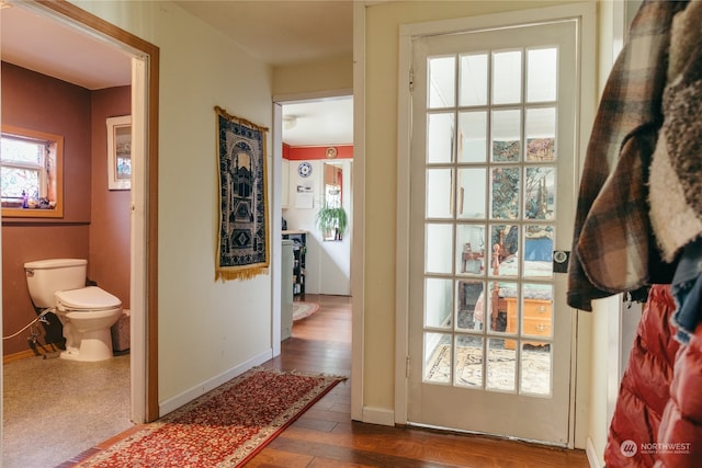 doorway to outside featuring dark hardwood / wood-style floors