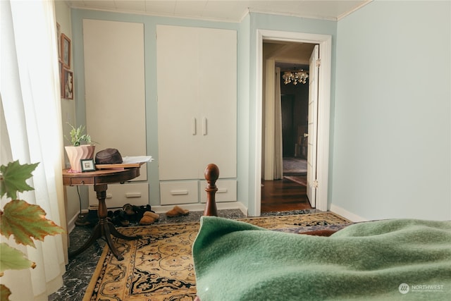 bedroom with wood-type flooring and crown molding