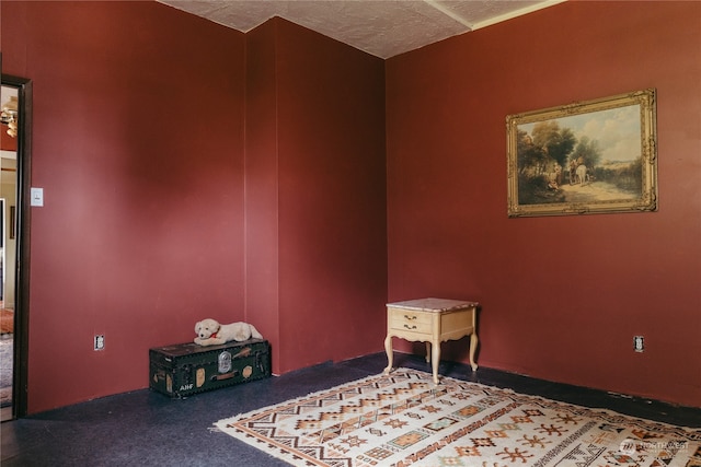 interior space featuring dark colored carpet