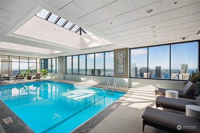 view of swimming pool featuring a skylight