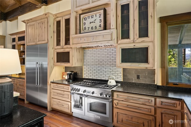 kitchen with high quality appliances, dark wood-type flooring, beam ceiling, decorative backsplash, and ventilation hood