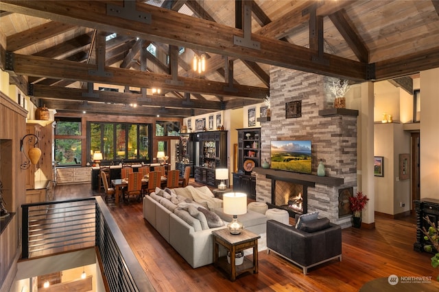 living room featuring a stone fireplace, wood ceiling, beam ceiling, wood-type flooring, and high vaulted ceiling