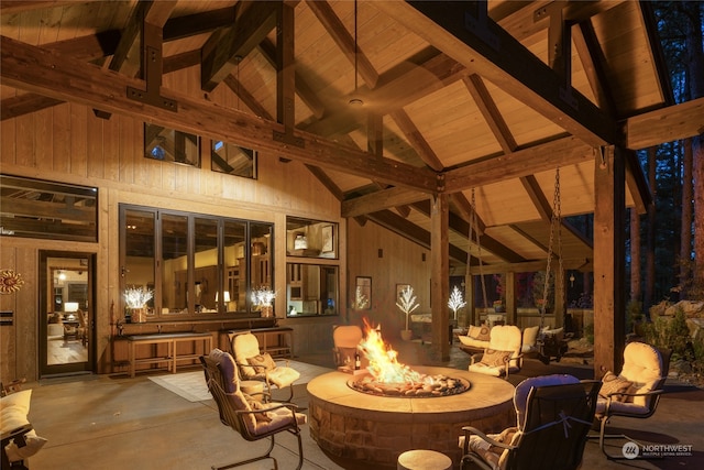 view of patio with a gazebo, an outdoor bar, and a fire pit