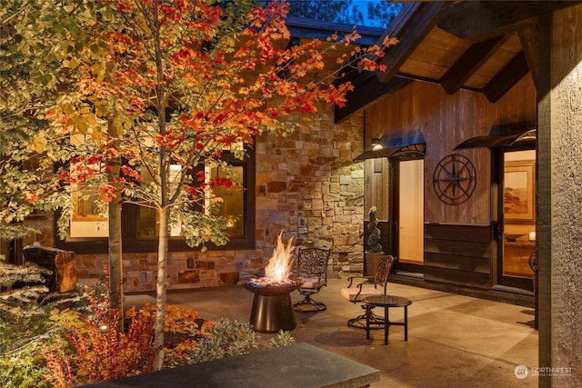 view of patio / terrace featuring an outdoor fire pit