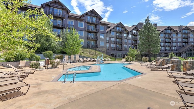 view of swimming pool featuring a patio area