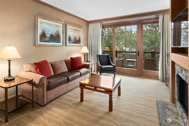 living room featuring a fireplace, light colored carpet, and ornamental molding