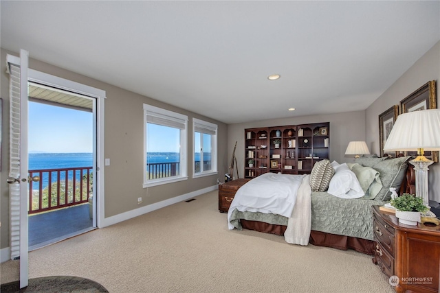 carpeted bedroom with access to outside, visible vents, baseboards, and recessed lighting