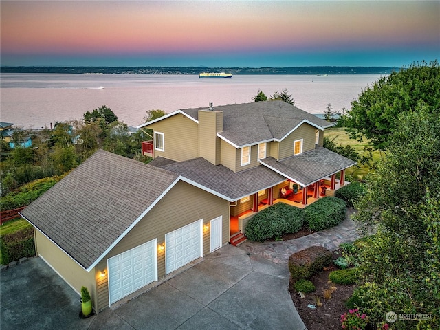 drone / aerial view featuring a water view