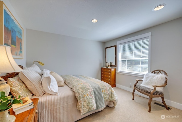 bedroom featuring light carpet, visible vents, baseboards, and recessed lighting