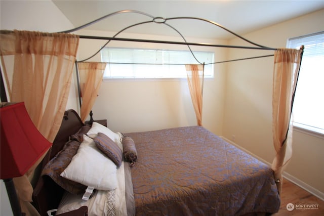 bedroom with hardwood / wood-style flooring