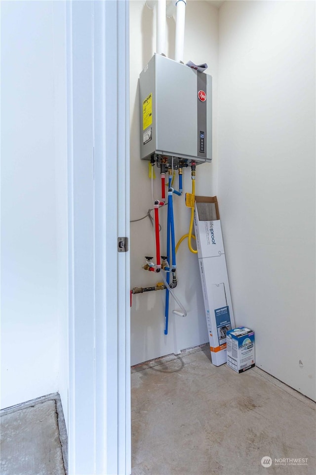 utility room featuring water heater